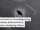 A famous UAP video shows an unexplained object as it soars high along the clouds, traveling against the wind. Department of Defense via AP